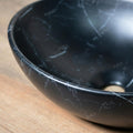 Ceramic counter top wash basin in matt black, rectangular bowl depth detail for premium sanitaryware