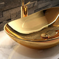 Table top wash basin in bathroom interior, gold oval ceramic basin above counter with tap hole detail