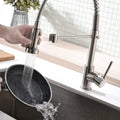 Retractable sink faucet for kitchen sink with pull-down hose and single lever control, chrome finish detail