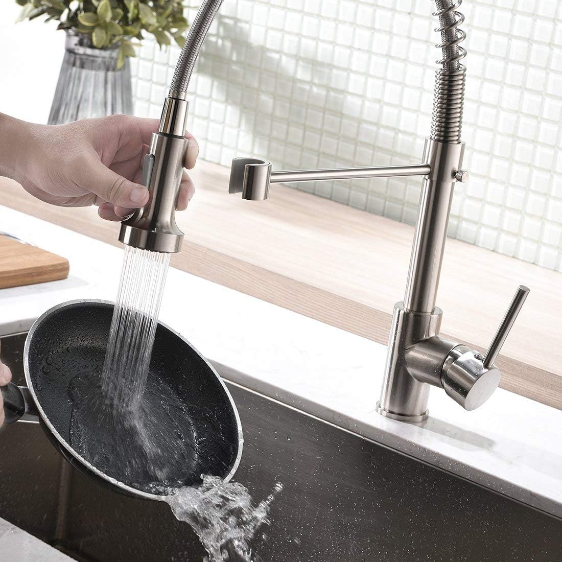 Retractable sink faucet for kitchen sink with pull-down hose and single lever control, chrome finish detail