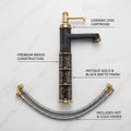 Modern bathroom wash basin mixer single lever tap, high neck tall body, gold black matte, angled view