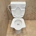 Anglo Indian water closet S trap in glossy white, side angle view of square ceramic commode with flush tank