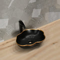 InArt table top basin design in matte black and gold ceramic, side angle view for modern bathroom