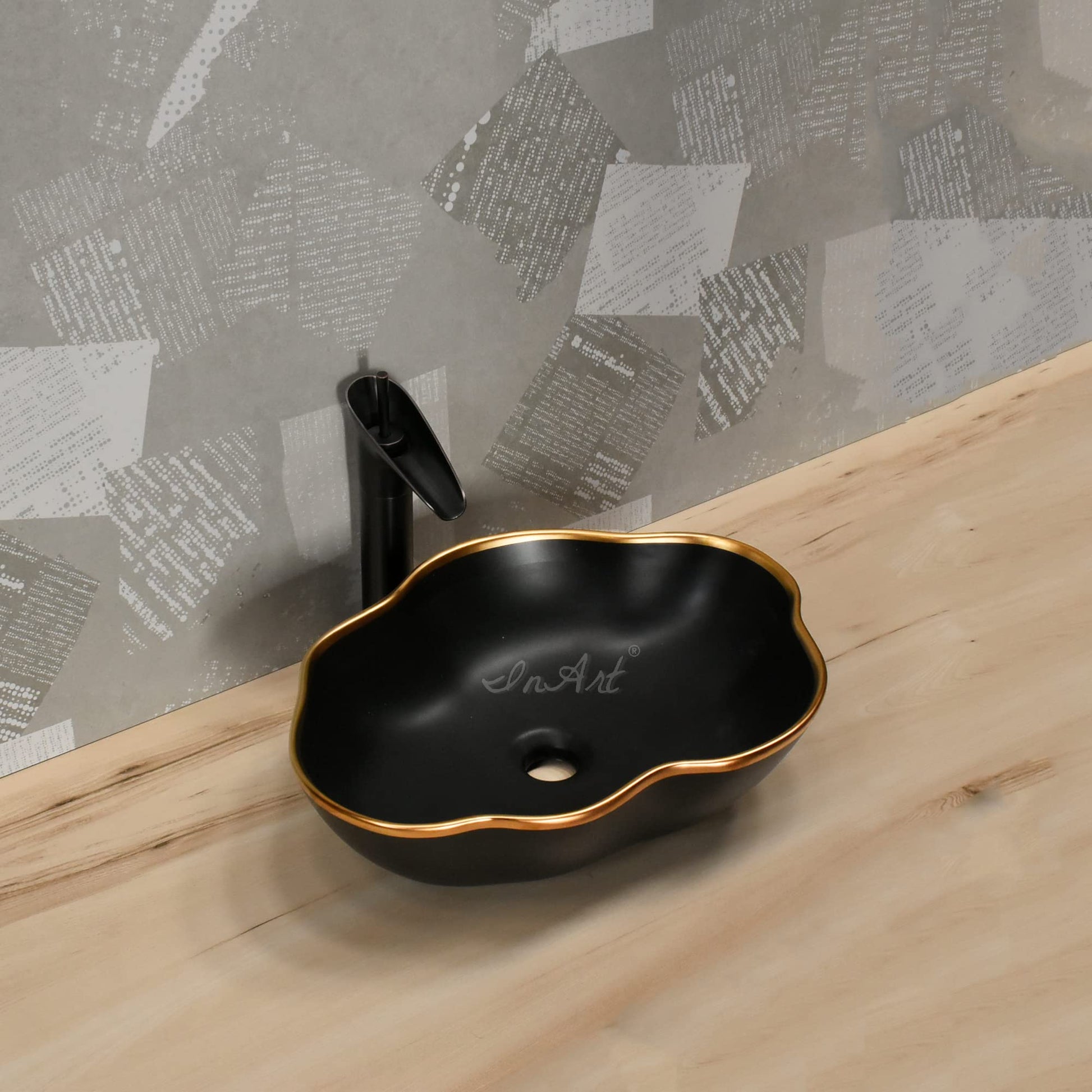InArt table top basin design in matte black and gold ceramic, side angle view for modern bathroom