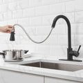 InArt black kitchen sink faucet with pull down sprayer, 360° rotatable gooseneck, rear angle view