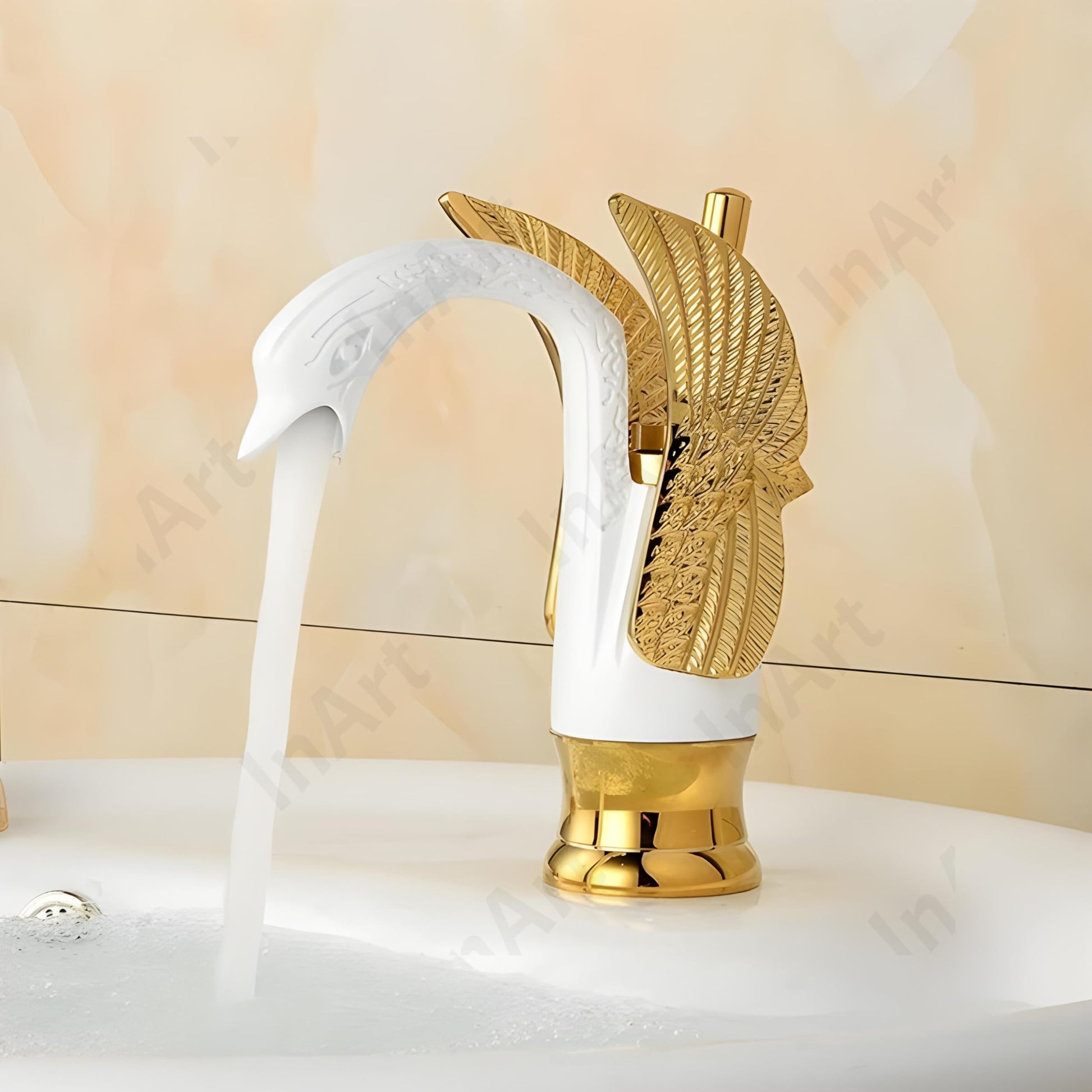 InArt designer wash basin tap in gold finish, swan neck deck mount mixer tap, angled view
