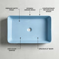 Designer blue vanity wash basin in ceramic, rectangular table top basin, 3/4 angle view