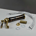 Modern wash basin mixer single lever tap with waterfall spout, angled view in black gold antique finish