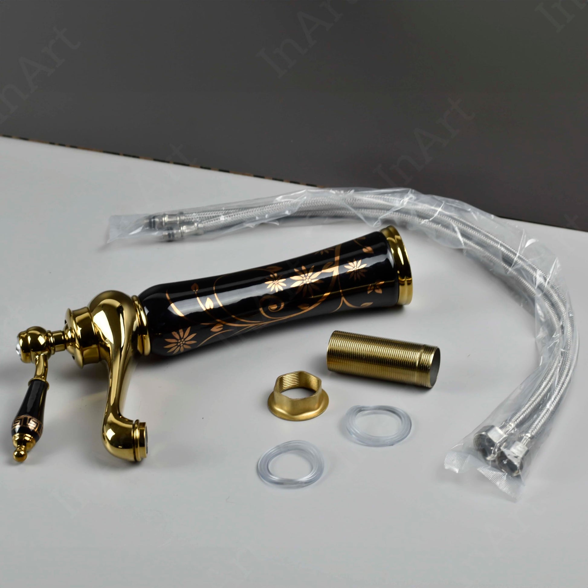 Modern wash basin mixer single lever tap with waterfall spout, angled view in black gold antique finish