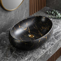 Round ceramic table top wash basin in Black Gold Fusion satin finish, front view