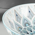 InArt table top wash basin counter design, round ceramic basin in light blue glossy finish on counter