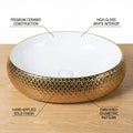 Glossy gold ceramic table top wash basin, round bowl design, side angle for modern washroom