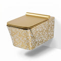 Designer wall mounted WC for modern washroom, glossy white square ceramic commode with gold leaf pattern finish