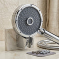Hand shower in bathroom with chrome wall mount hook and flexible hose, ideal for daily bathing