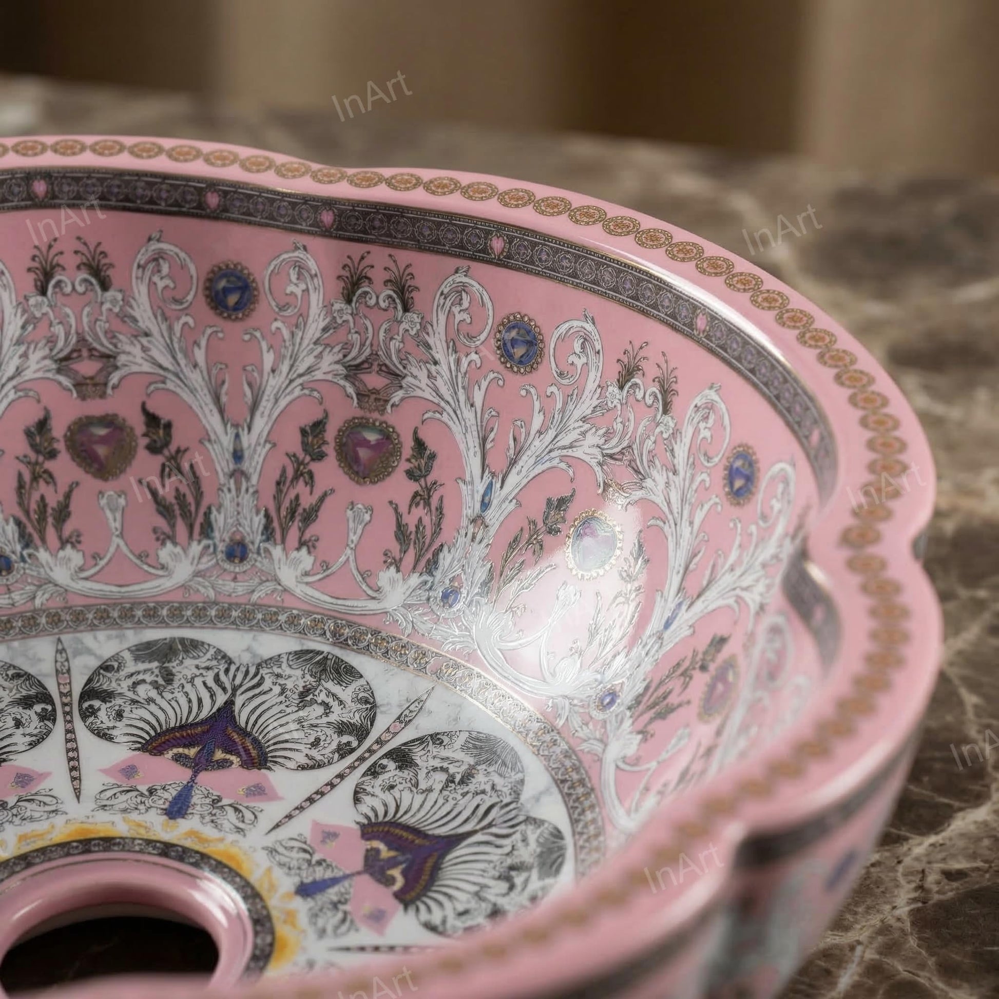 Table top wash basin counter design with InArt pink ceramic basin on vanity, tap and drain view