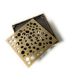 Close-up of InArt floor drain jali slots in antique brass, easy-clean design for bathroom and kitchen