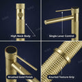 Modern bathroom waterfall basin tap in gold finish, side angle view of deck mount brass mixer body