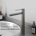 Close-up of InArt basin tap handle and spout in gun grey, premium brass bathroom taps and mixers for washroom