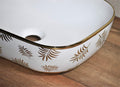 Close-up of glossy golden ceramic countertop sink rim, premium sanitaryware finish for luxury bathroom