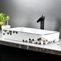 Designer table top wash basin design in black white ceramic, rectangular basin, top corner angle