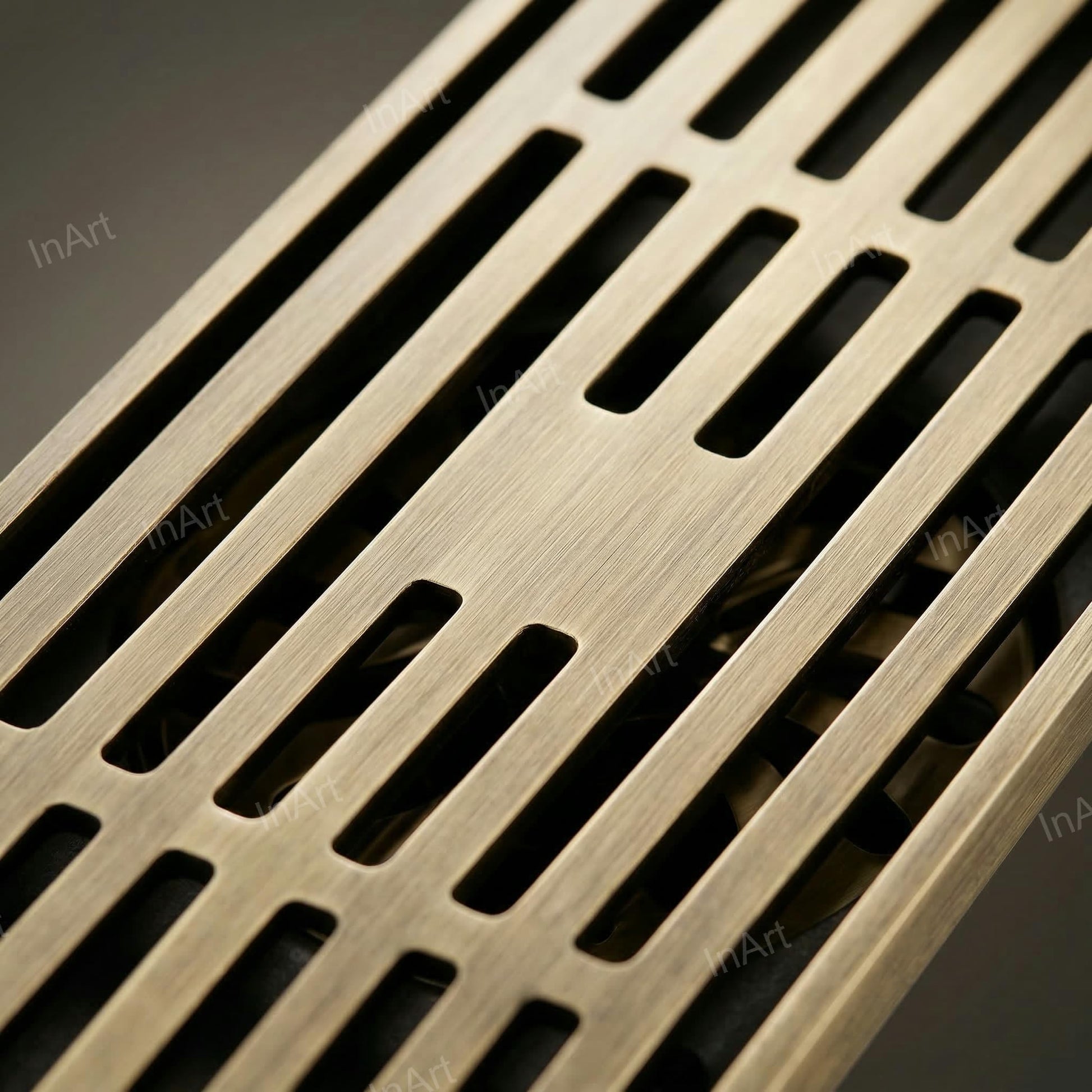 Close-up of antique brass floor drain jali slots with anti-foul cockroach trap for washroom drainage