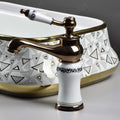 Close-up of InArt single lever wash basin mixer handle and glossy rose gold plating, contemporary design
