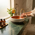 InArt matte finish wash basin close-up, smooth brown ceramic rim and round bowl detail