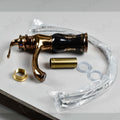 InArt wash basin mixer tap in black rose gold, angled view of single lever basin pillar tap with waterfall spout