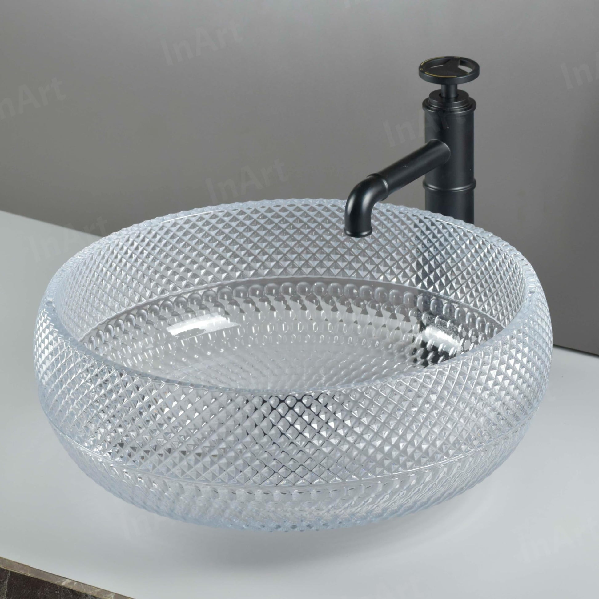 Designer glass wash basin design, square clear countertop basin with luxury green tint, side angle view