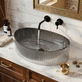 InArt glass table top wash basin with easy-clean glossy black finish, close-up rim detail