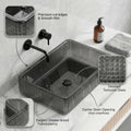 Designer matte black wash basin in glass, table top rectangular sink, side angle