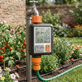 Garden watering timer connected between tap and drip irrigation pipe