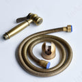 Washroom jet spray set for toilet in antique bronze, zinc hand spray with holder, angled close-up
