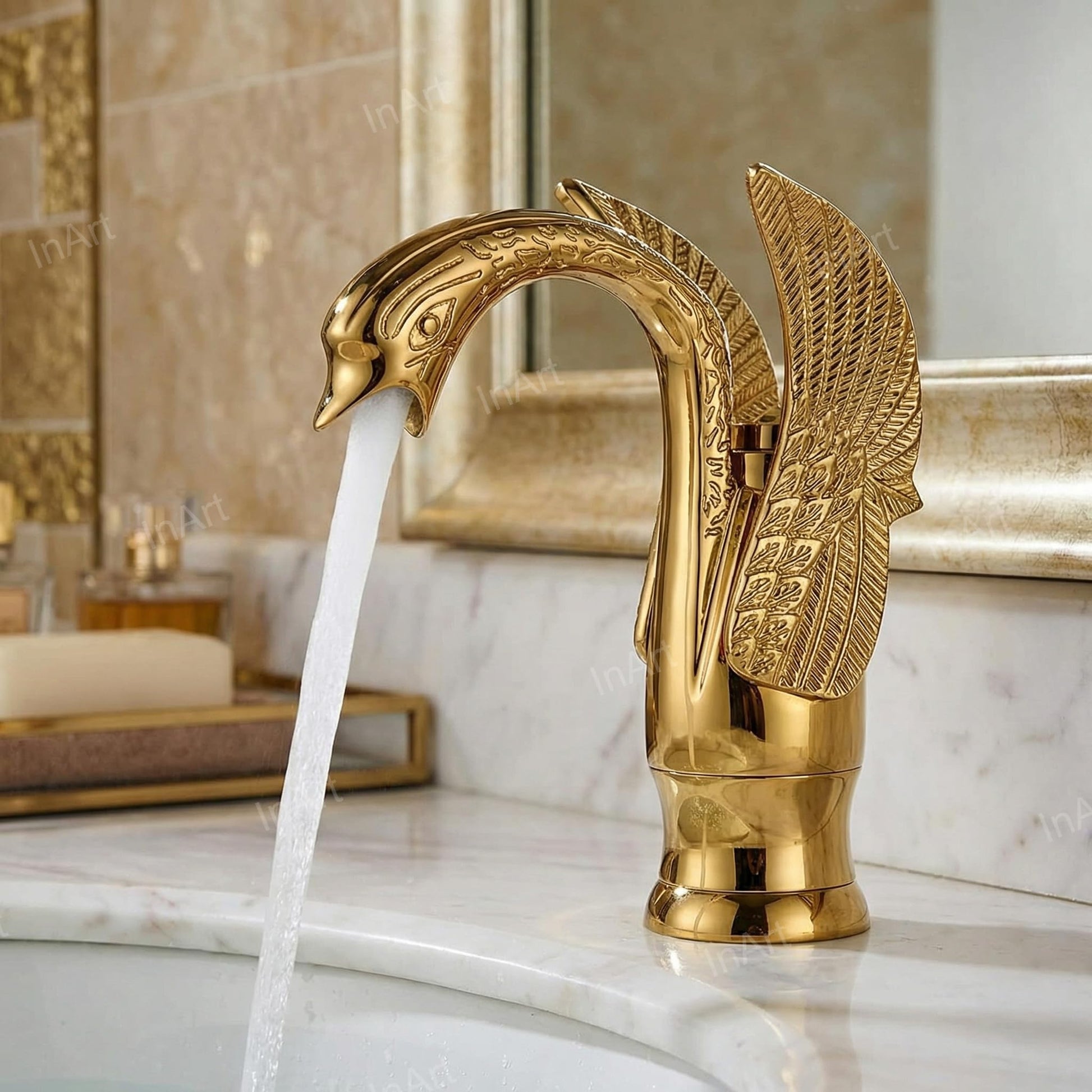 InArt waterfall basin tap close-up of glossy gold brass spout, smooth water fall outlet detail