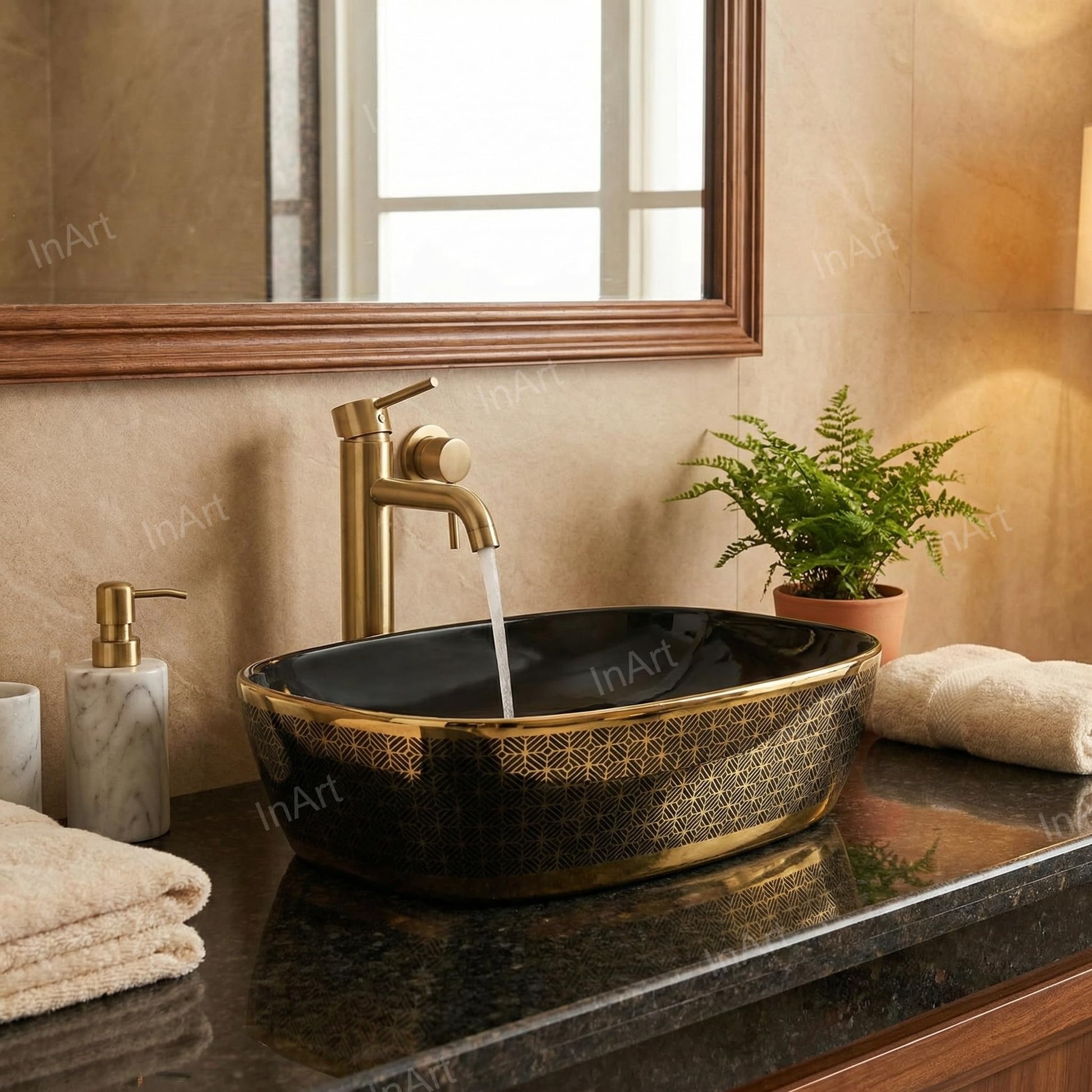 InArt tabletop washbasin close-up of glossy black gold finish and smooth oval bowl detailing