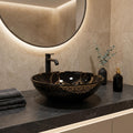 Modern bathroom wash basin design, round table top wash basin black and gold, top angle view