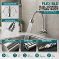 Corrugated metallic flexible spout detail on stainless steel kitchen tapware