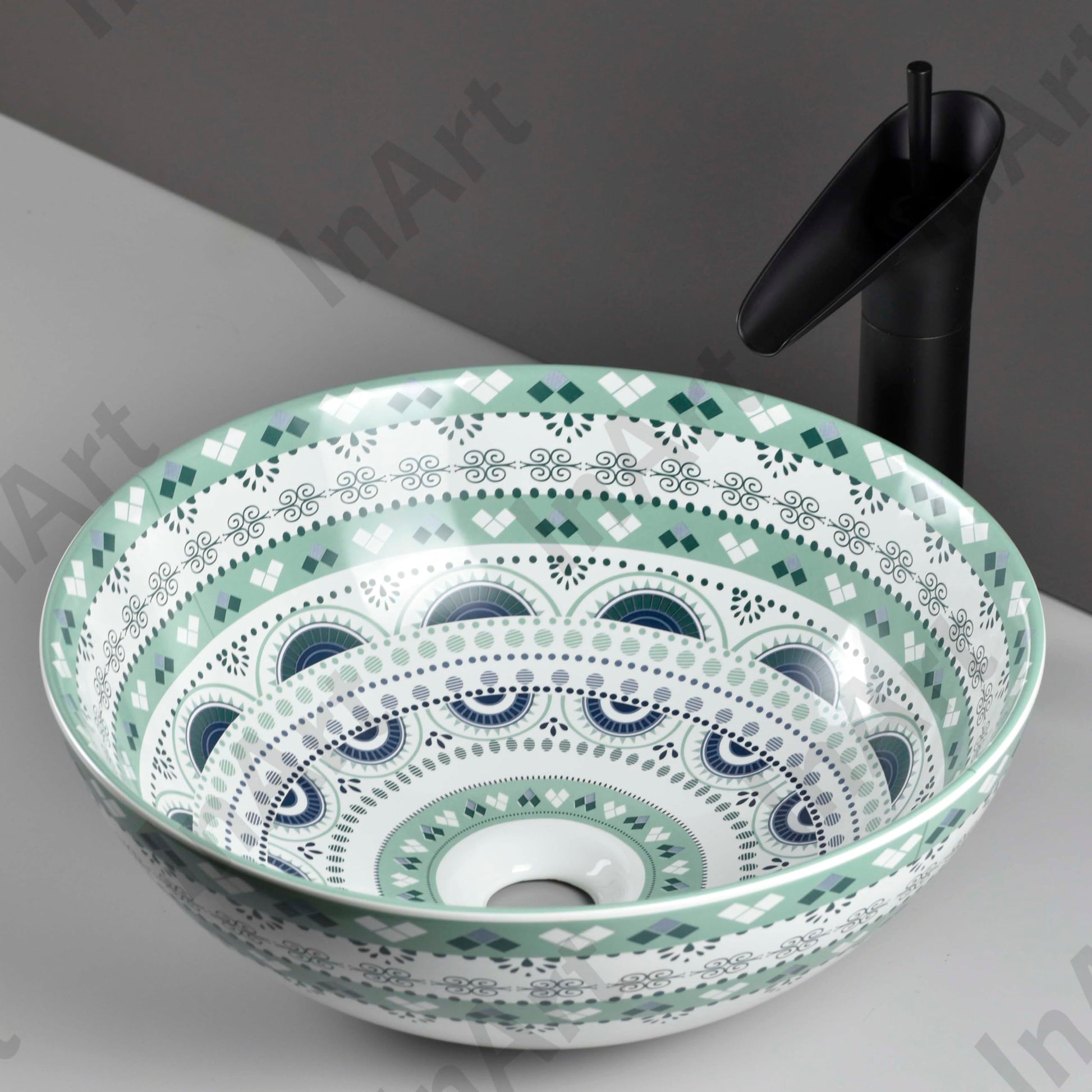 Close-up of InArt light blue ceramic tabletop washbasin design showing smooth glaze and rounded rim