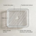 Designer clear glass wash basin table top, rectangular tempered glass sink shown at angled view