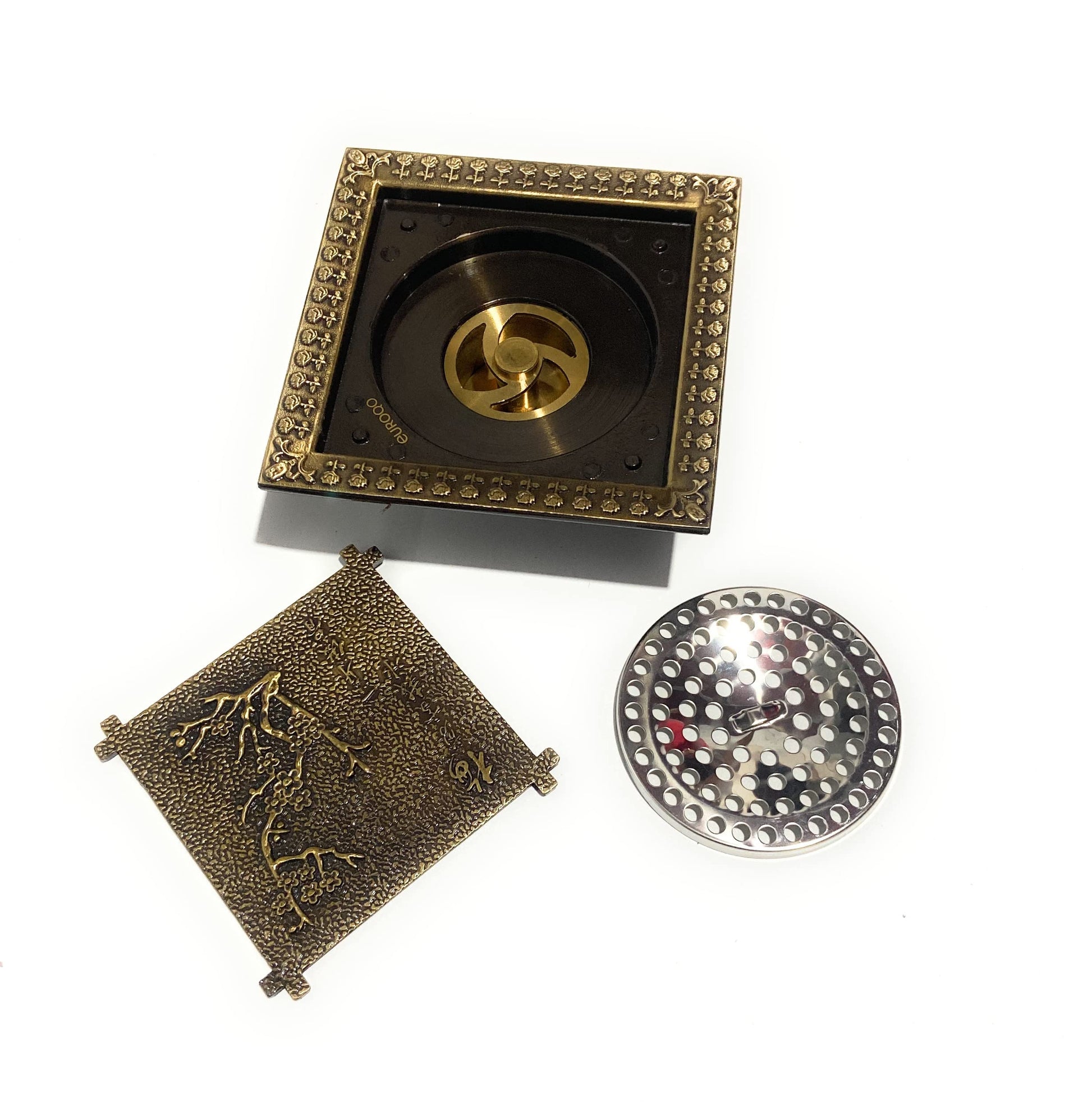 InArt premium sanitaryware brass floor drain jali in bronze finish, close-up of removable cockroach trap for washroom