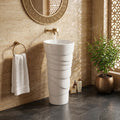 Designer pedestal wash basin in glossy white ceramic, round bowl with full pedestal, 3/4 angle view