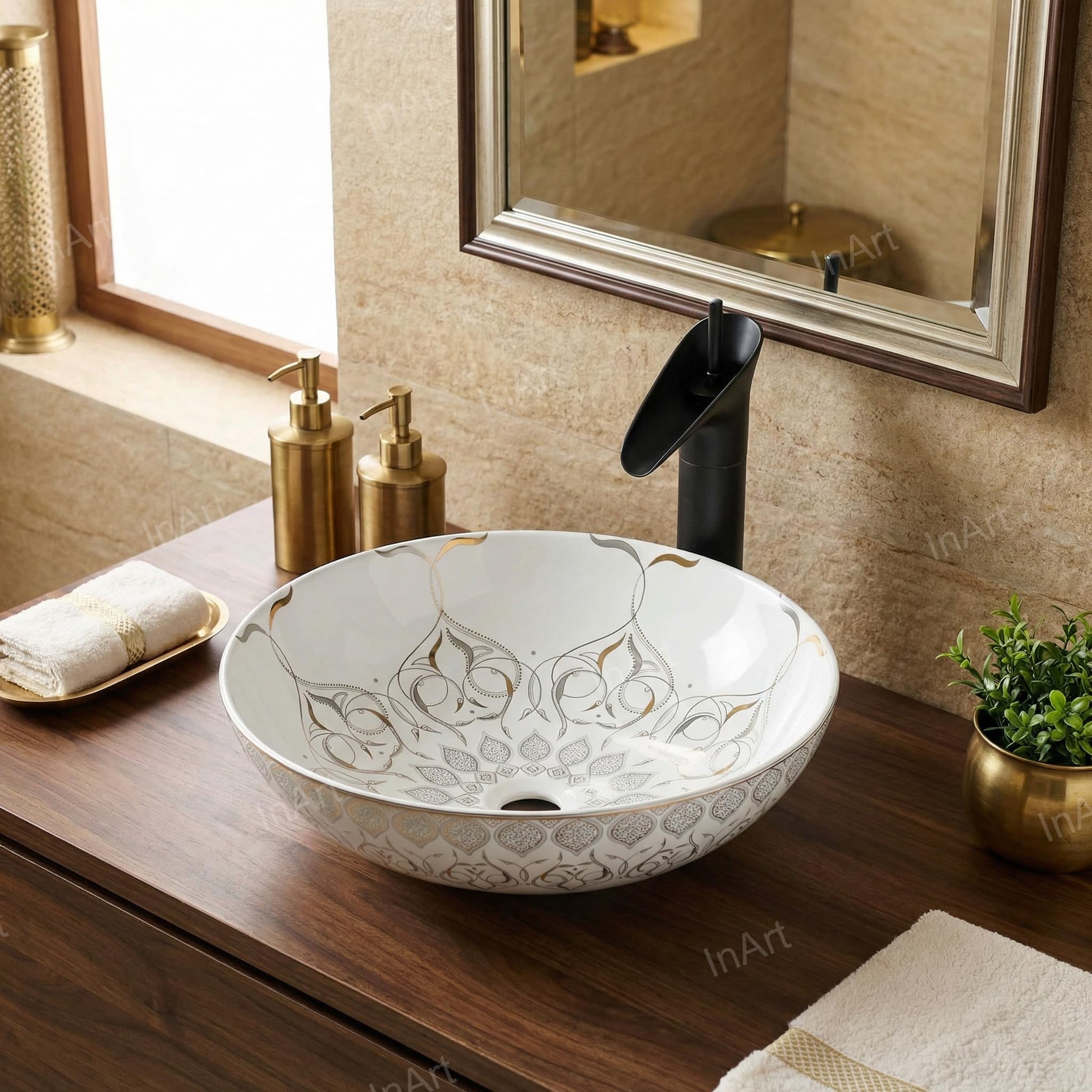 Close-up of glossy white ceramic wash basin with gold rim detailing, premium sanitaryware for bathroom