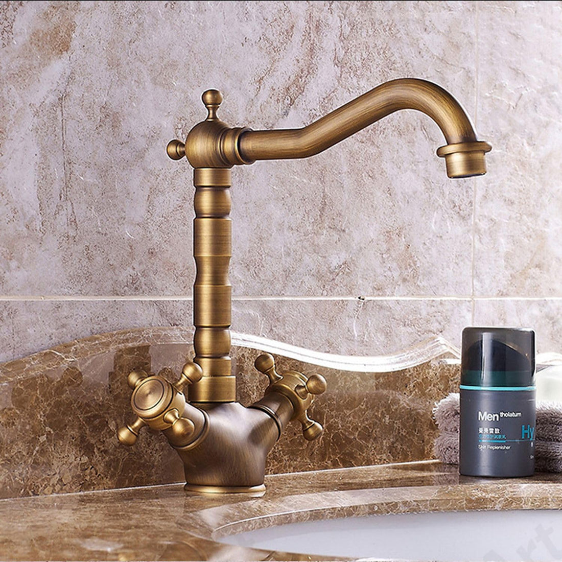 InArt waterfall basin tap in antique matt brass, deck mounted hot and cold mixer for bathroom wash basin