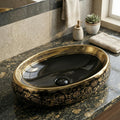 InArt black table top wash basin with gold finish, close-up of glossy ceramic surface and edges