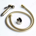 Bronze jet spray for toilet with hose and holder, angled view of handheld health tap for bathroom