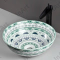 InArt table top wash basin counter design in a modern bathroom, round light blue basin with tap