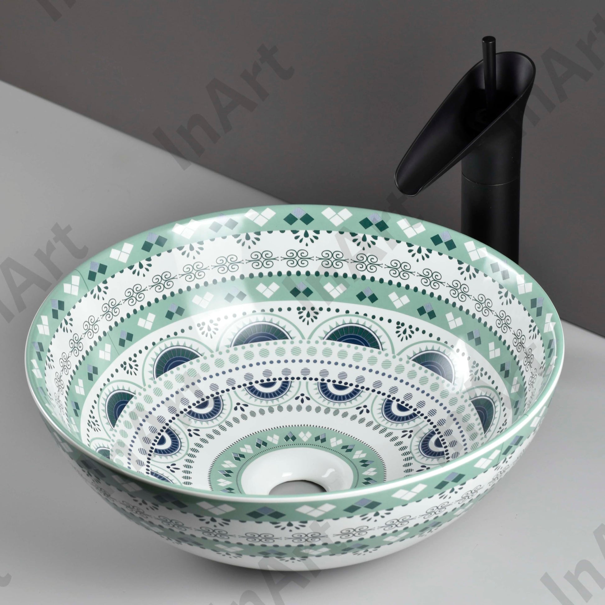 InArt table top wash basin counter design in a modern bathroom, round light blue basin with tap