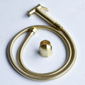 Handheld golden health faucet gun with durable brass body and flexible hose, ideal for Indian washroom