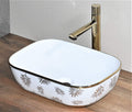 InArt designer ceramic wash basin rectangular in golden finish, angled view for modern bathroom vanity