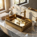 Close-up of InArt premium ceramic tabletop washbasin with rose gold finish, smooth rim and drain detail